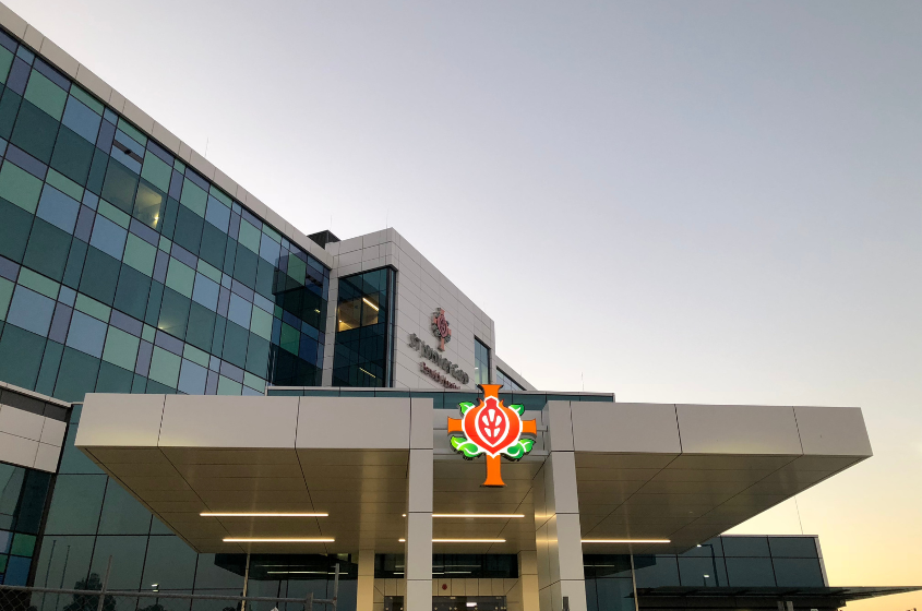 Exterior view of St John of God Berwick Hospital at sunset